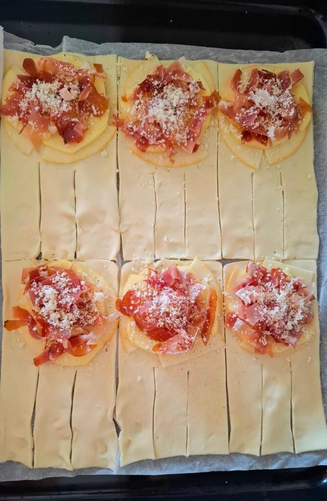 Parmigiano e pepe su speck 