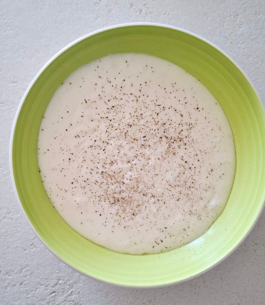 Besciamella con fontina e spolverata di pepe