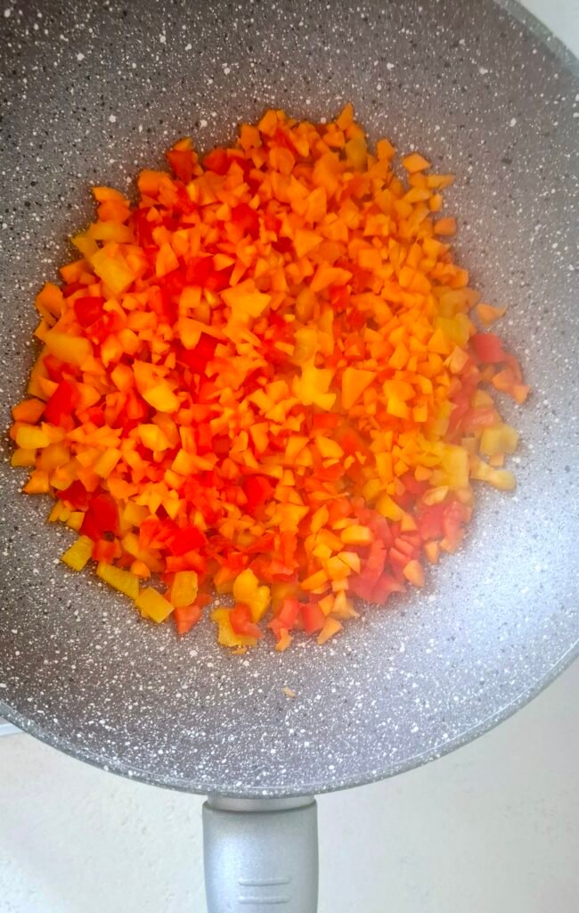 Carote e peperoni in wok a fuoco alto